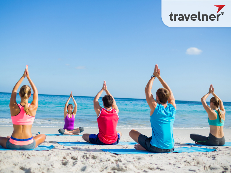 Free Yoga class is taking place on the beach. Free Yoga class is taking place on the beach.