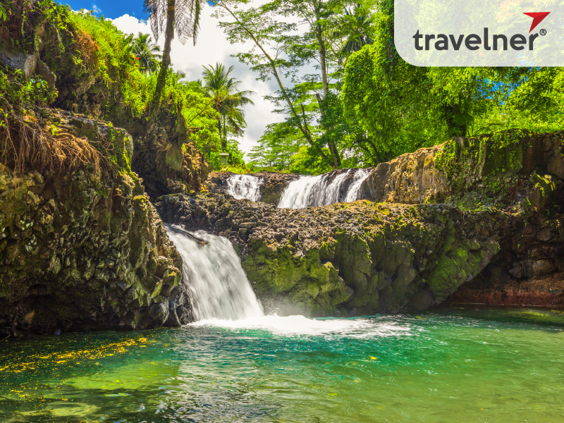 Togitogiga waterfall flows through the tropical jungle. Togitogiga waterfall flows through the tropical jungle.