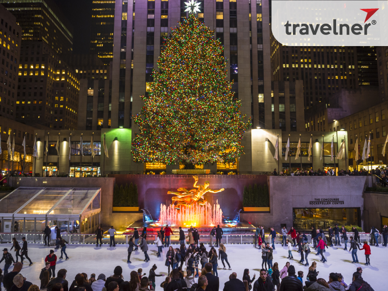Travelers are skating right under the world's tallest Christmas tree.